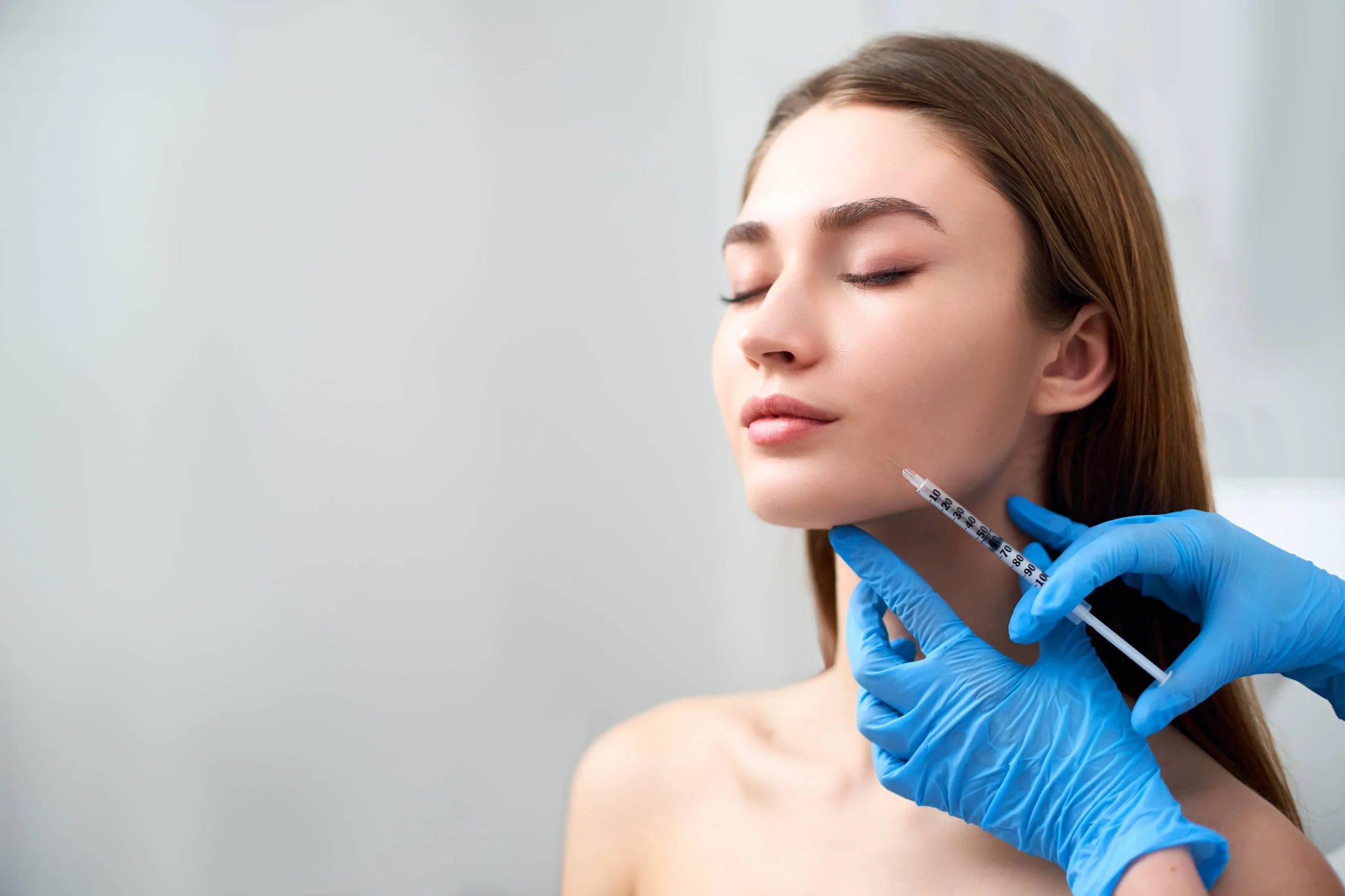 Young female getting dermal fillers treatment in Owensboro, KY | Owensboro Dermatology
